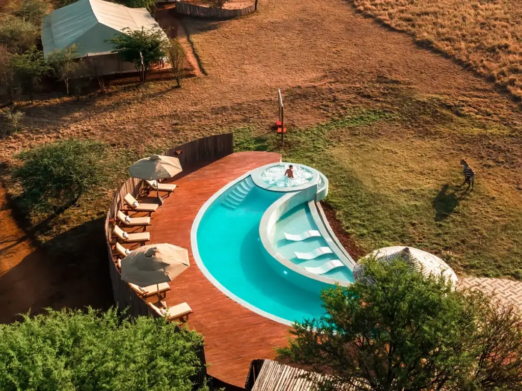 A heated infinity pool at One Nature Nyaruswiga overlooking the Serengeti.