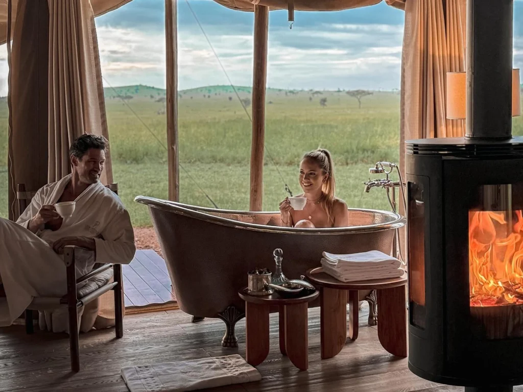 A beautifully designed copper bathtub in a private lodge suite, overlooking the serene African wilderness.