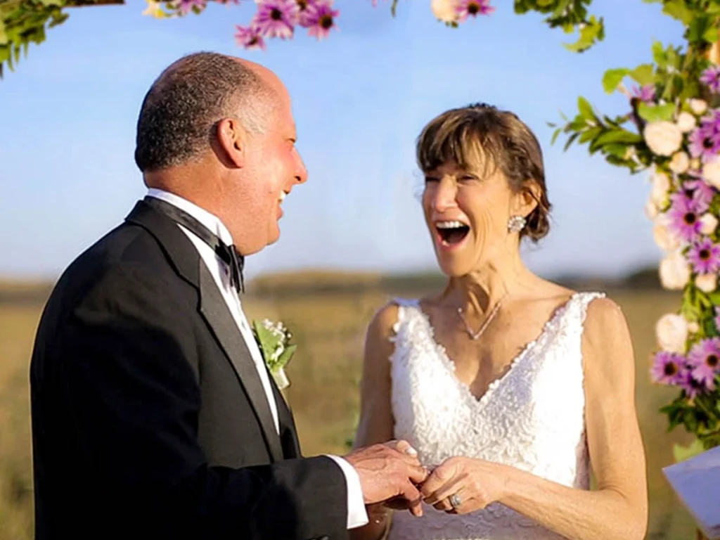 Joyful married couple smiling on their beautiful wedding day at One Nature Hotels, Serengeti, Tanzania.