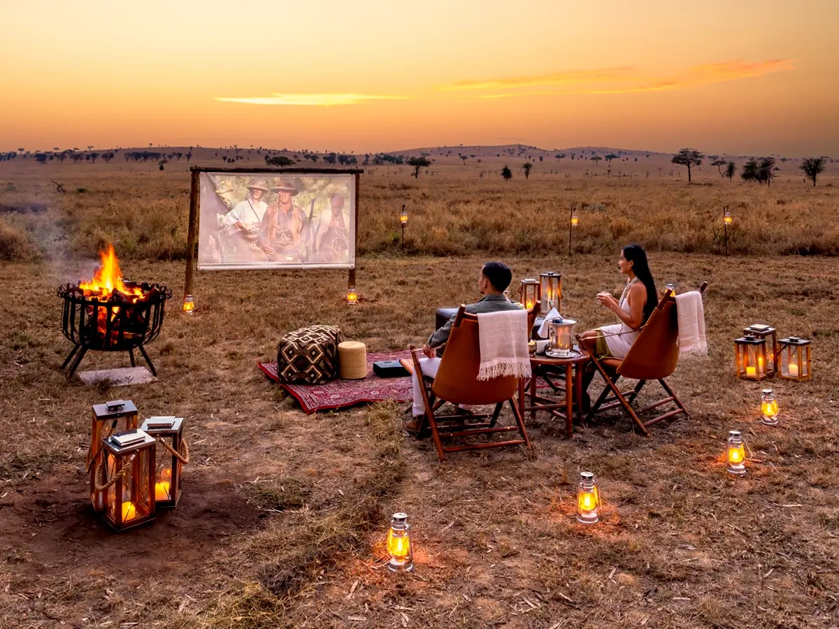 One Nature guests share bush brunch in Serengeti, enjoying holidays with family, friends, and wildlife views.